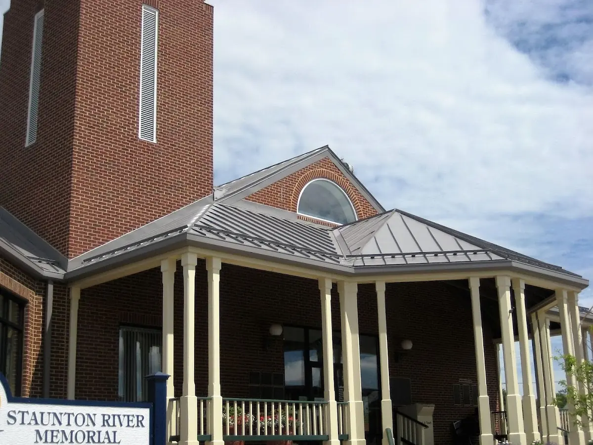 Skilled roofing craftsmen working on a residential roof in West Rushville